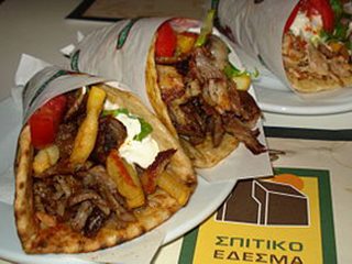 Two gyros wrapped in pita