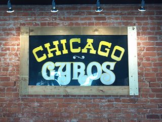 Chicago Gyros neon-style sign on brick wall