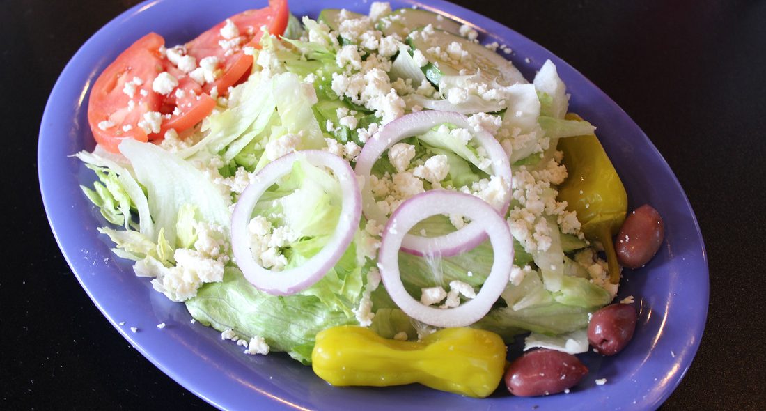 Greek salad with feta, red onion, kalamata olives and pepperoncini