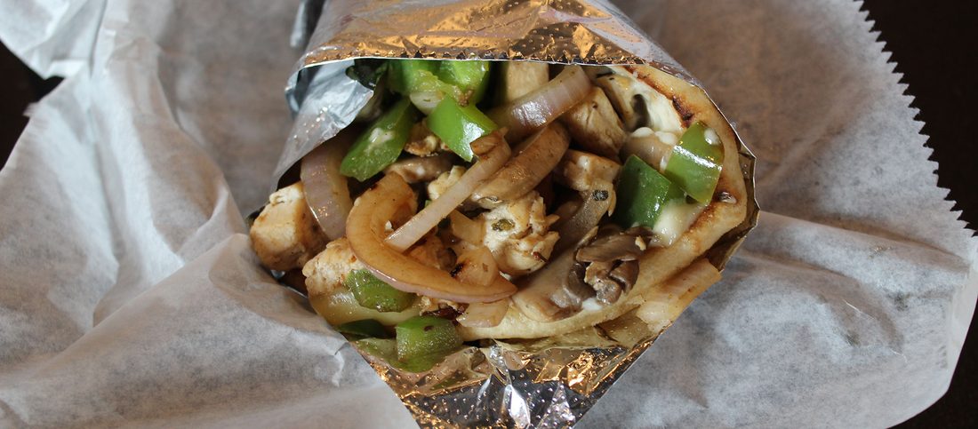 Philly gyro with grilled onions, green peppers and mushrooms wrapped in foil